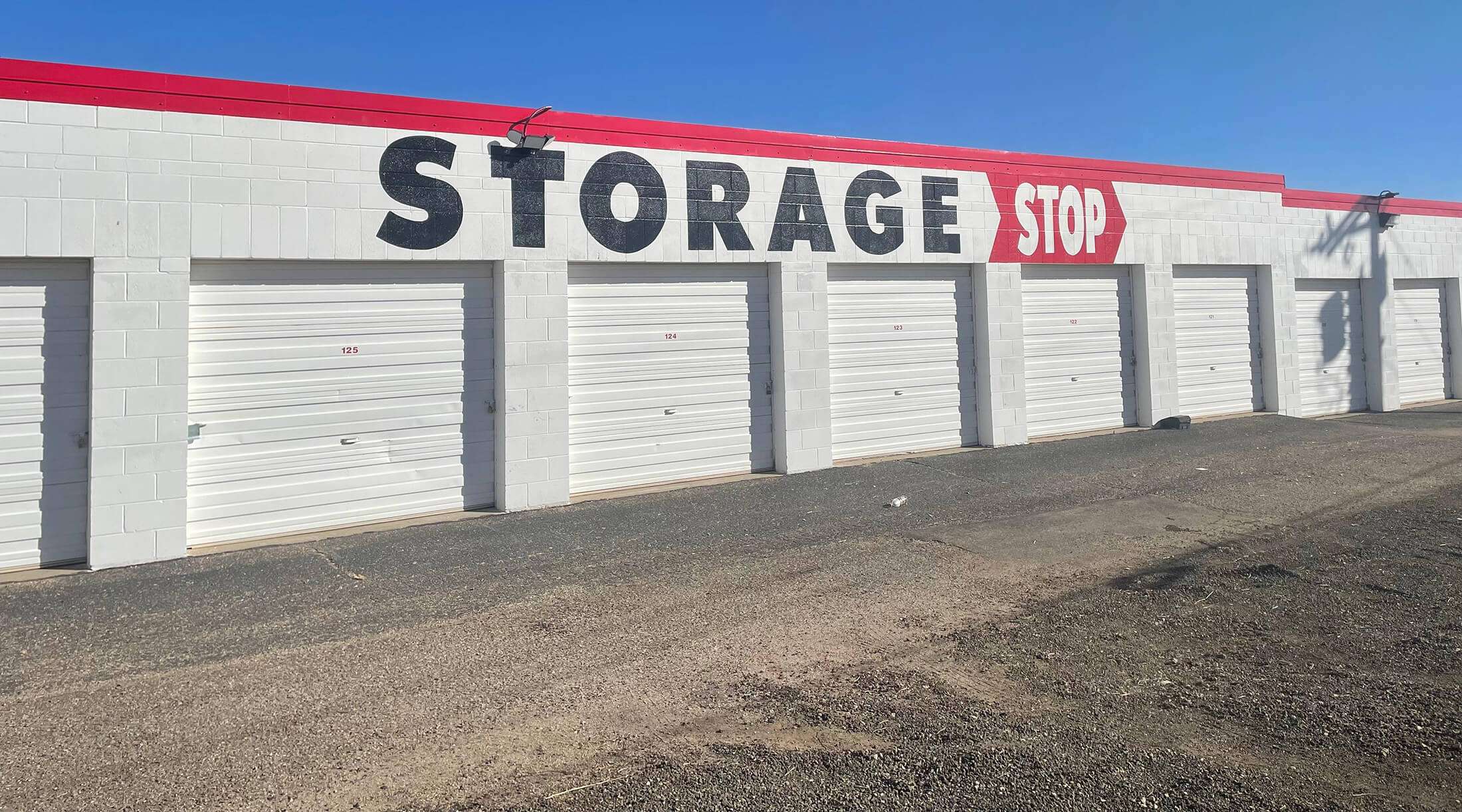cameras and lighting installed above secure drive up self storage units 