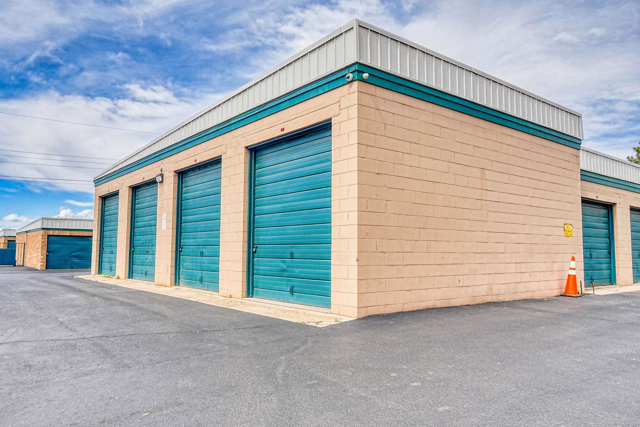 Self storage units with teal doors
