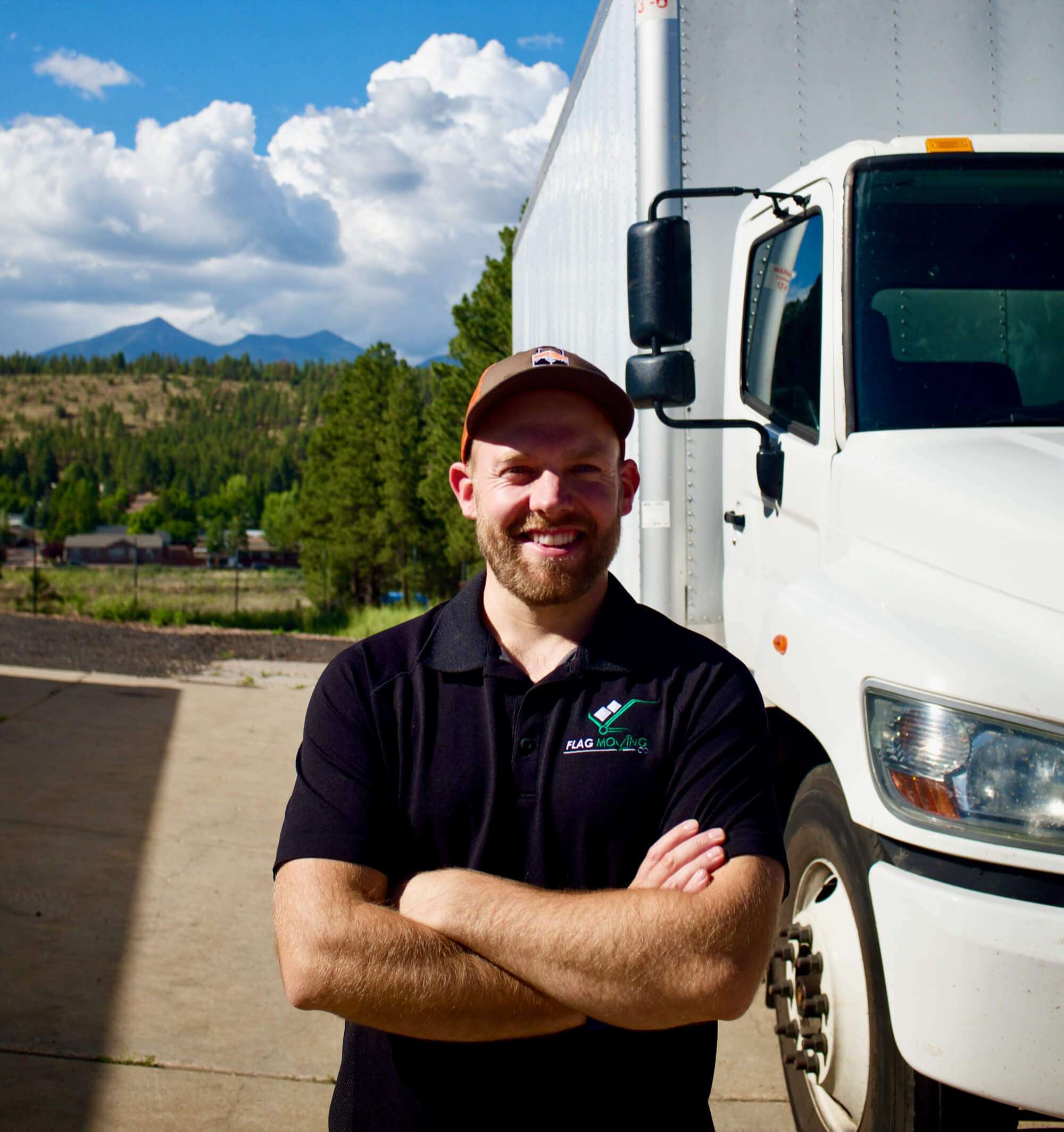 Employee in front of moving truck