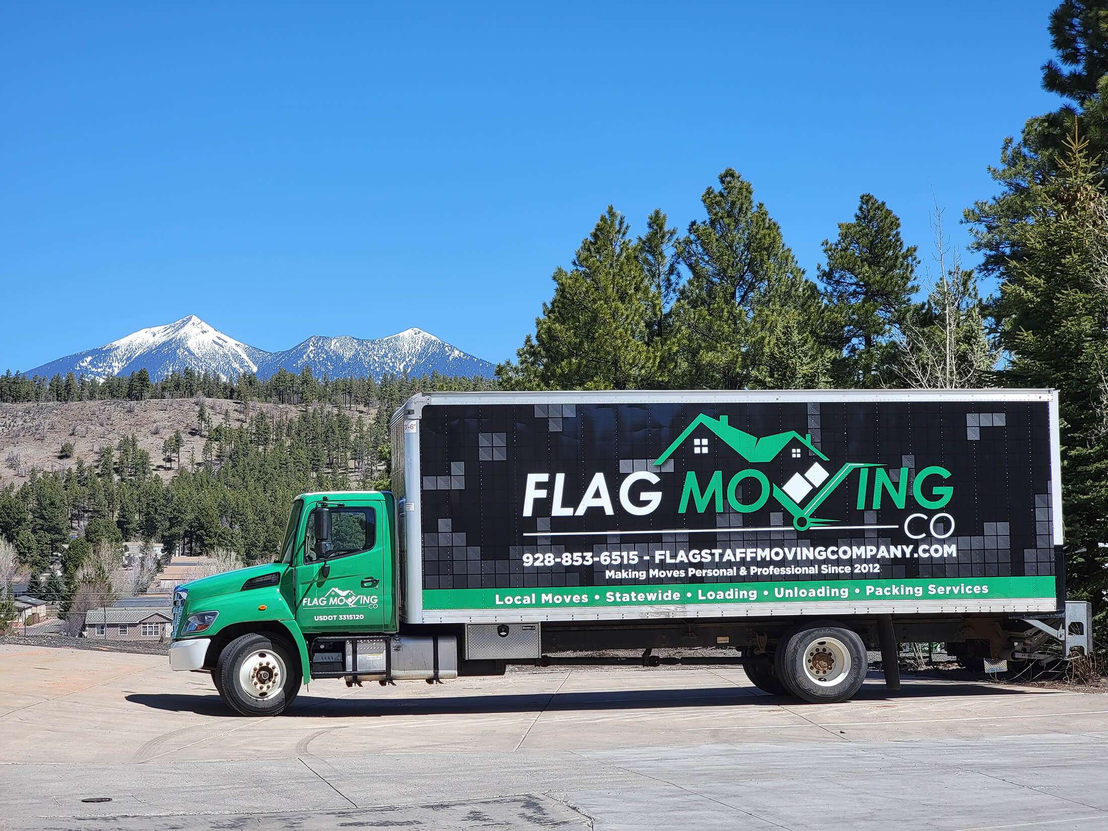 Moving truck with mountains in background
