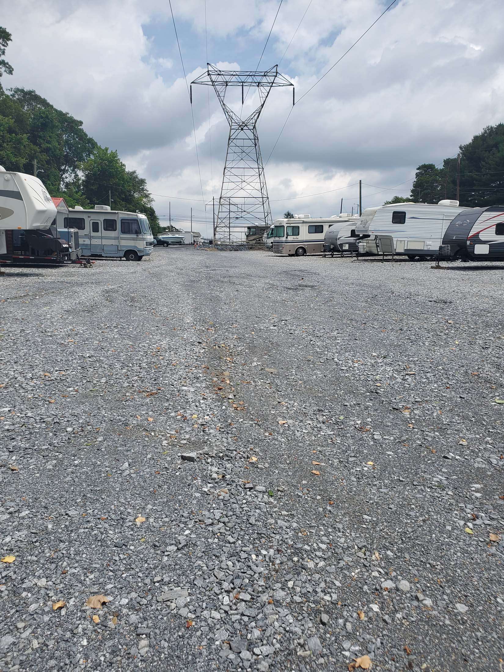 Gravel aisle between vehicles at storage facility