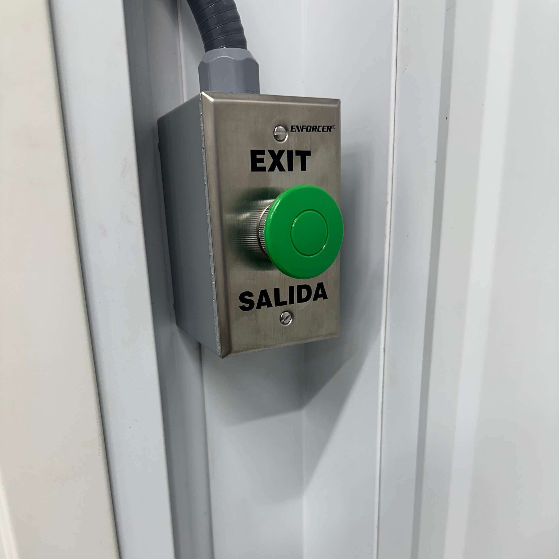exit button for loading dock roll top door