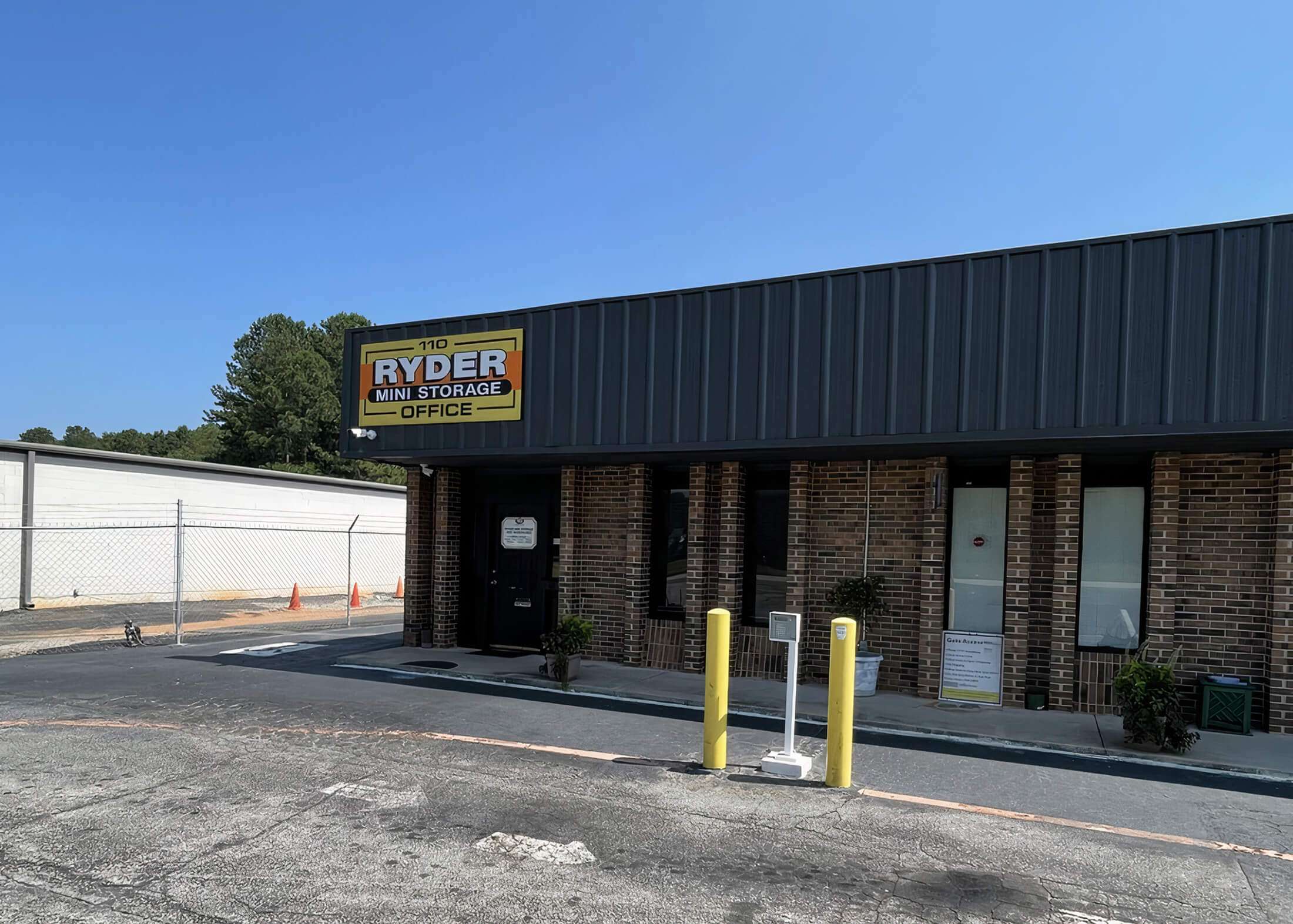 signage and front entrance to self storage facility office
