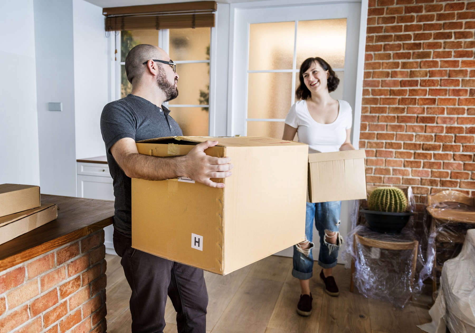 Young Couple Moving Into Home