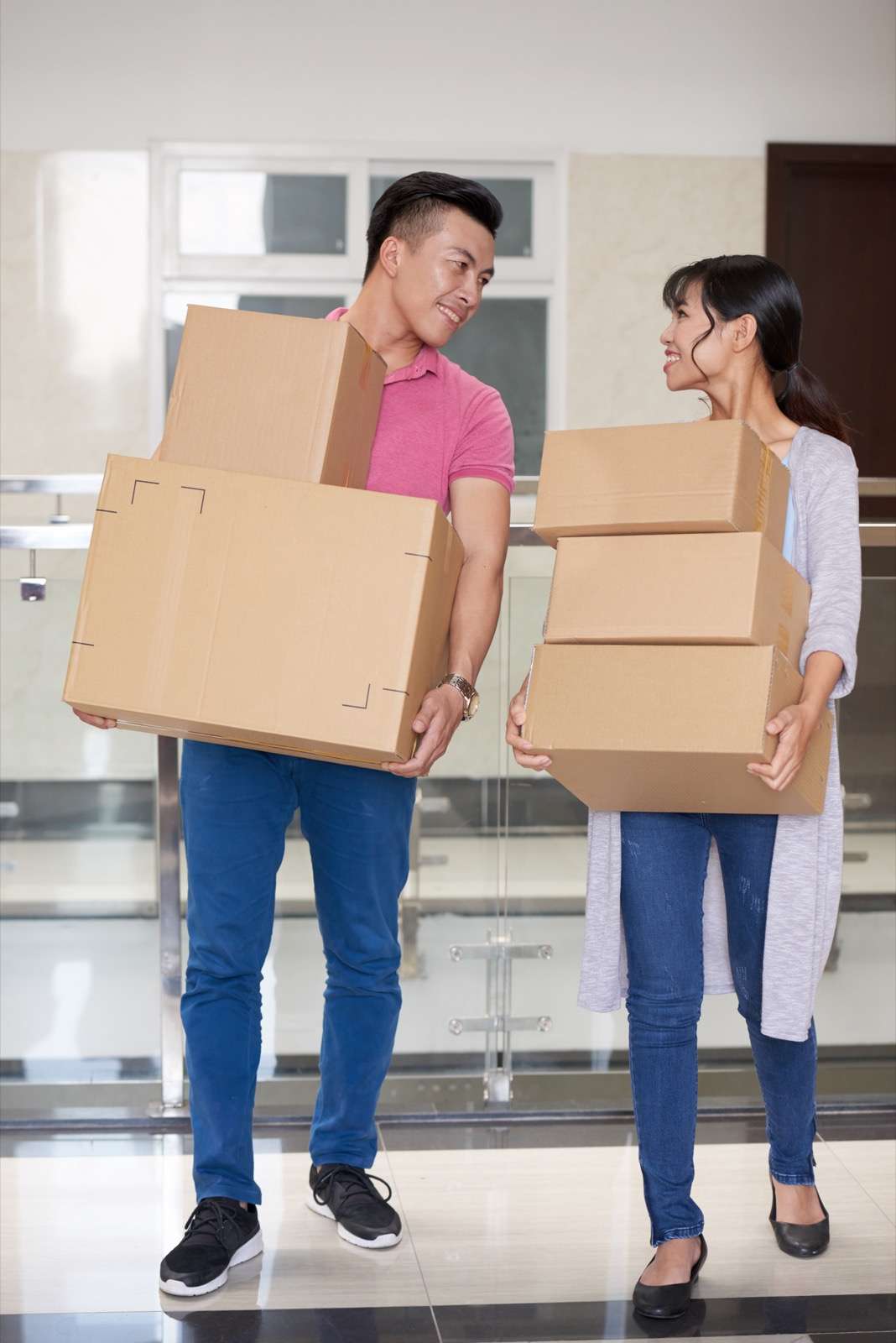 Happy Couple Moving Boxes
