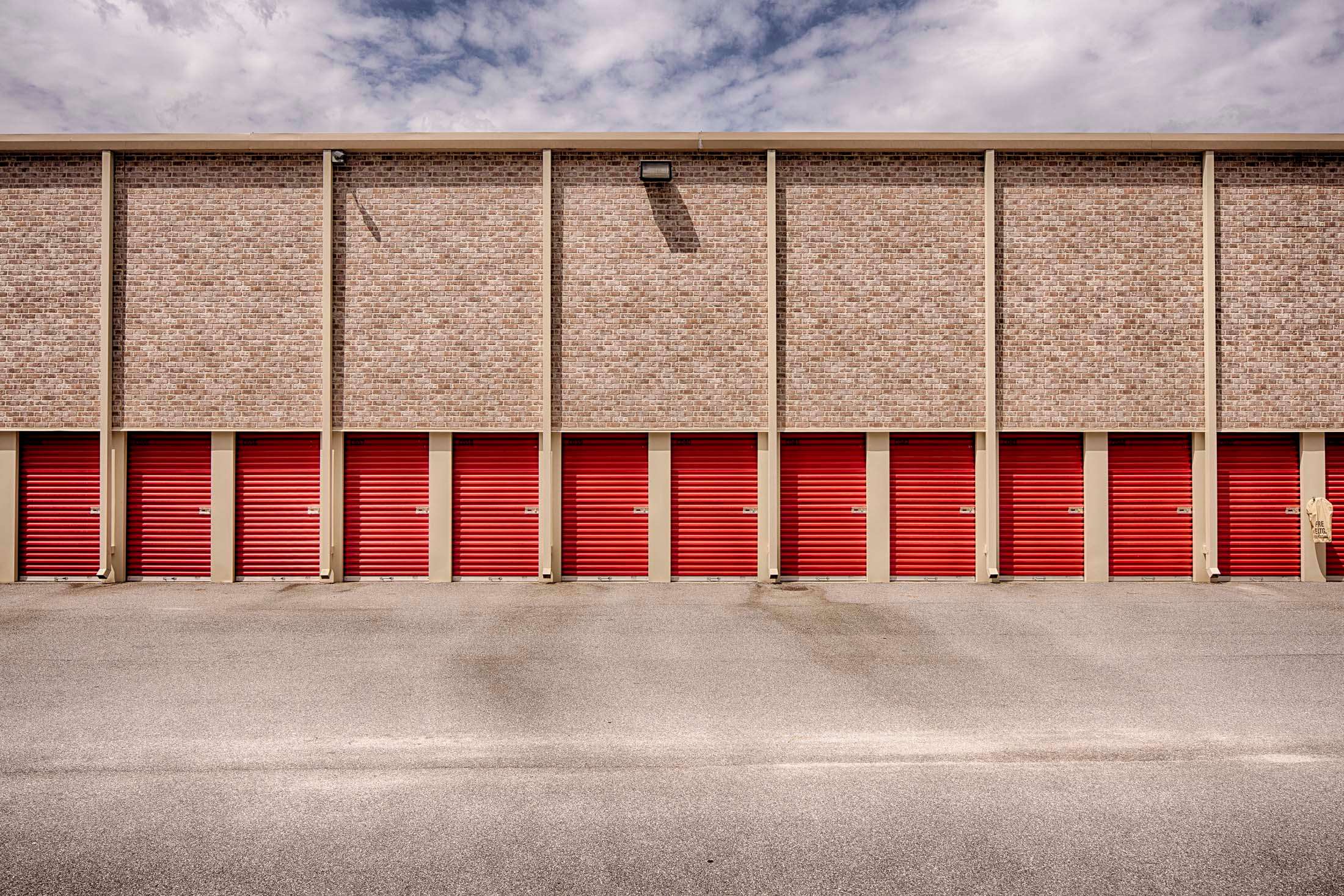 Row of storage units with red doors
