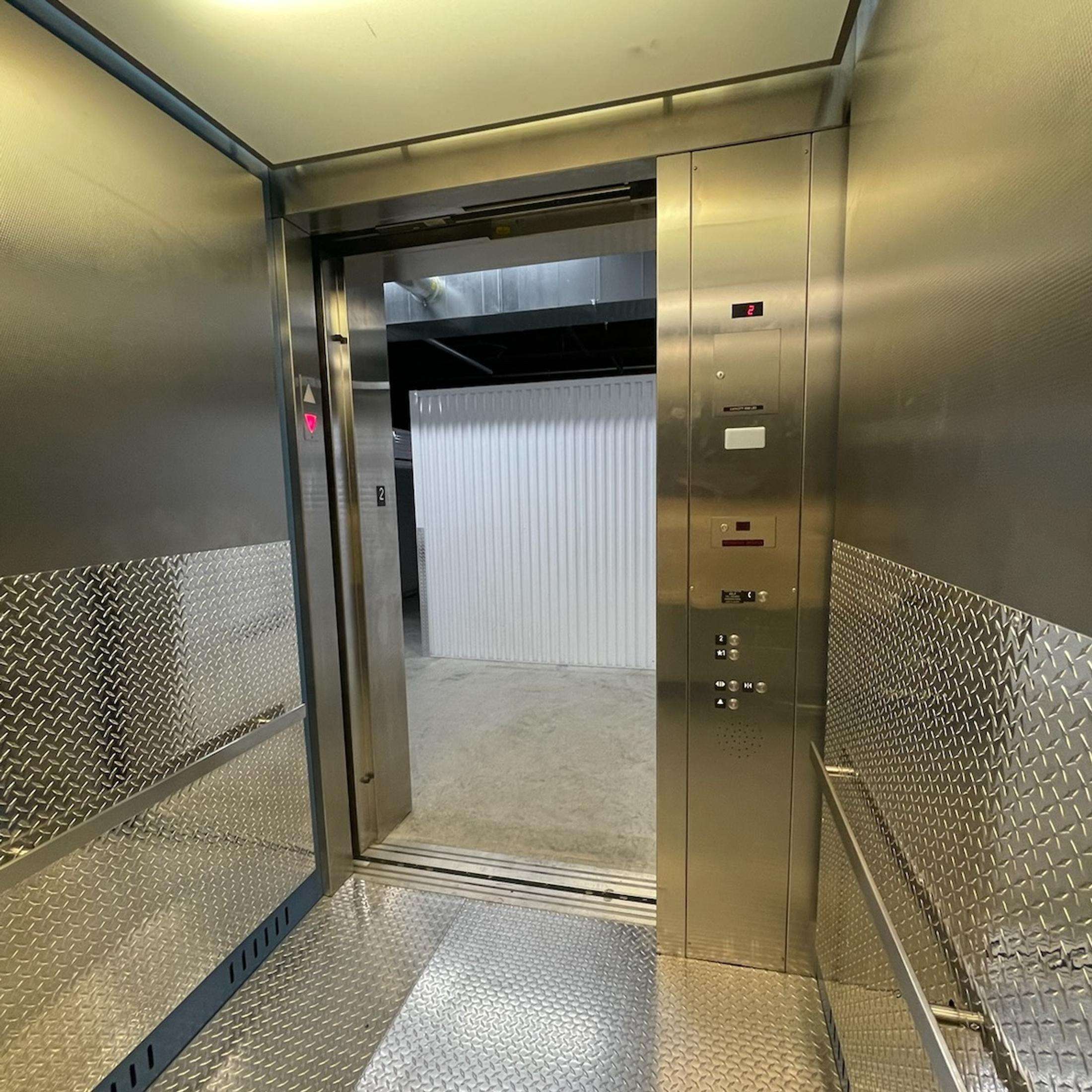 Elevator access to upper floor storage units