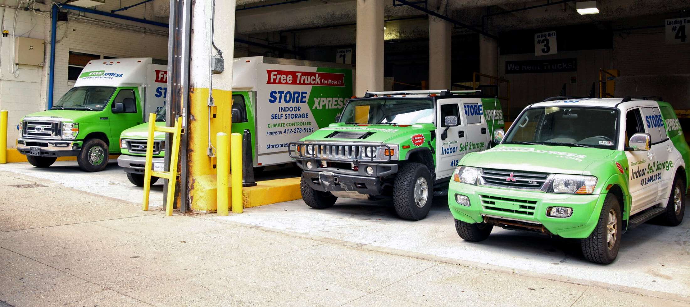 Free moving vehicles offered with self storage rental parked at loading docks