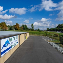 Paved driveway surrounding self storage units