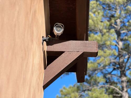 Security camera mounted on storage facility